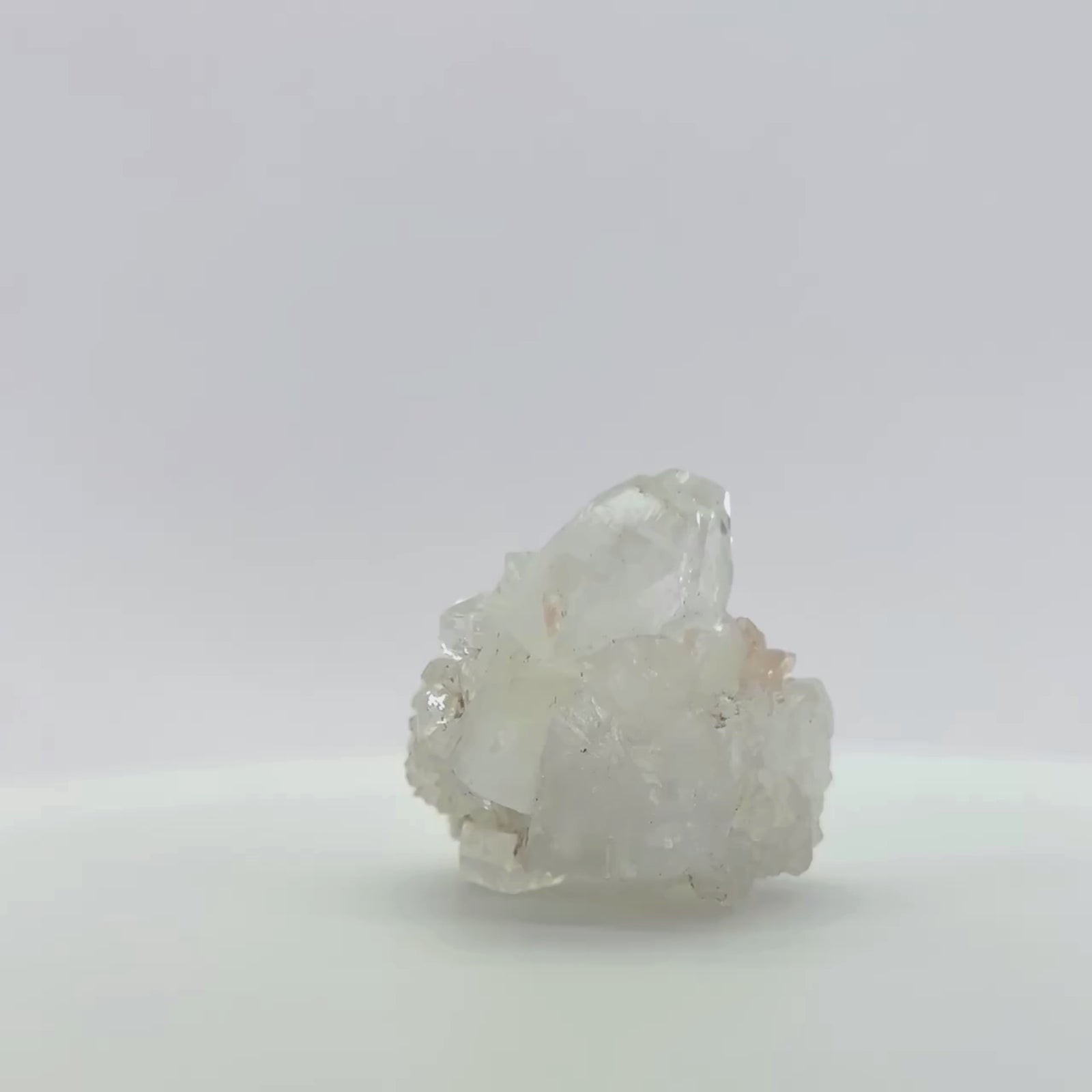 Clear Apophyllite Crystal w/ mini light pink Stilbite